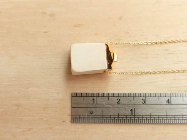 golden house diffuser necklace