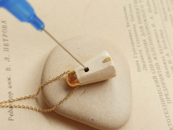 golden house diffuser necklace